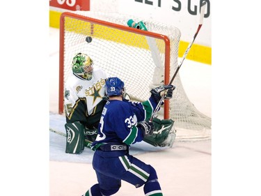 Apr. 23, 2007: Henrik Sedin (33) scores on Dallas Stars goalie Marty Turco (35) during the second period of game seven in the first round of the NHL Stanley Cup playoffs at GM Place Stadium.
