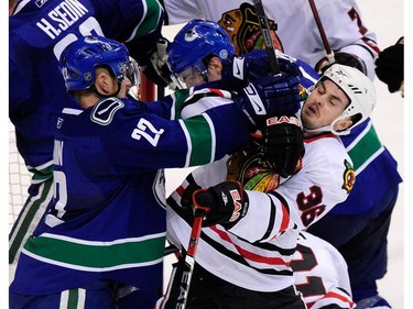 May 9, 2009: Daniel Sedin (22) pushes  Chicago Blackhawks' centrew Dave Bolland (36)  during first period round two game five NHL Stanley Cup playoffs at GM Place.