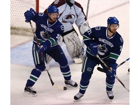 Vancouver-February 27, 2008-Vancouver Canucks  Sedin twins in front of   Colorado Avalanche goalie Jose Theodore  in NHL action Wednesday night at GM Place.  (Steve Bosch/Vancouver Sun) [PNG Merlin Archive]