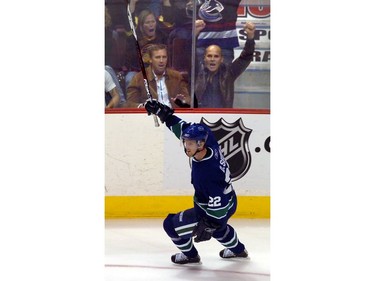 Oct. 13, 2006: VDaniel Sedin celebrates his goal with fans  in game against San Jose Sharks in NHL opener at Gm Place.