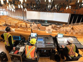 Workers prepare the Ted Talks main theatre in Vancouver, a "pop-up" structure of 8,000 Douglas-fir-timber components, a process that takes 154 hours, "give or take."
