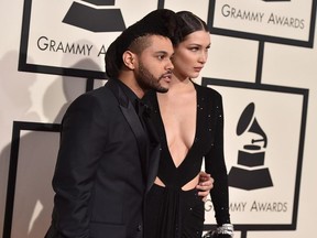 The Weeknd, left, and Bella Hadid arrive at the 58th annual Grammy Awards at the Staples Center on Monday, Feb. 15, 2016, in Los Angeles.