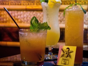 A Navy Grog, left a Peneng Afrididi #2, center and a Zombie, right are three the of the cocktail drinks on the list at the The Shameful Tiki Room on Main Street.