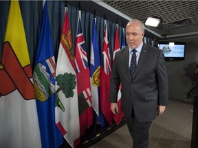 B.C. Premier John Horgan leaves a news conference after discussing his meeting with Prime Minister Justin Trudeau and Alberta Premier Rachel Notley over the deadlock concerning Kinder Morgan's Trans Mountain pipeline expansion, on Parliament Hill in Ottawa on April 15.