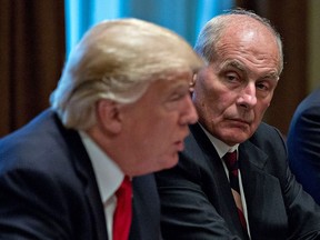 White House chief of staff John Kelly listens as U.S. President Donald Trump speaks at a briefing in the White House Oct. 5, 2017 in Washington, D.C.