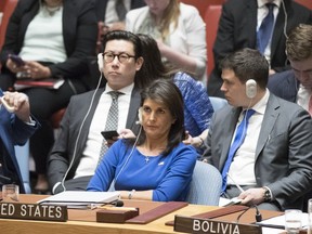 American Ambassador to the United Nations Nikki Haley listens as Syrian Ambassador to the United Nations Bashar Ja'afari speaks after a vote on a resolution during a Security Council meeting on the situation in Syria, Saturday, April 14, 2018 at United Nations headquarters.