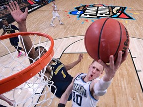 Donte DiVincenzo of the Villanova Wildcats drives to the basket against Charles Matthews of the Michigan Wolverines in the second half during the 2018 NCAA Men's Final Four National Championship game at the Alamodome on April 2, 2018 in San Antonio, Texas. (Jamie Schwaberow - Pool/Getty Images)
