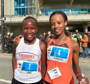 Monicah Ngige of Kenya (right), winner of the Vancouver Sun Run women's race, poses with Jane Murage. Ngige won the women's race with a time of 32:24.