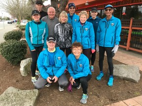 John and Joan Young, front row, pose outside a Richmond A&W with some of the Forever Young Club runners who are taking part in the 34th Vancouver Sun Run on Sunday, April 22. The runners are, back row from the left: Lloyd Wilson, Pete Erickson, Wai Kam, Joan Masse; middle row, Jodi Pelling, Lynn Parsons, Gwen McFarlan and Akram Khan.