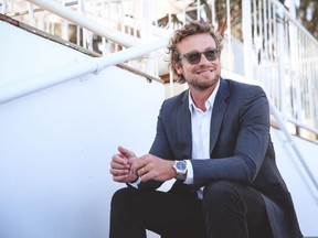 Australian actor Simon Baker sits outside the Longines Record Club in Surfer's Paradise, Queensland.