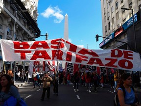 Members of leftist organizations demonstrate against the rise of public services fares and the government's negotiations with the International Monetary Fund (IMF), in Buenos Aires, on May 16, 2018.