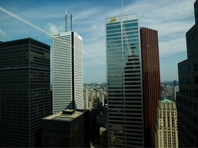 The BMO Financial Group tower, from center left, the Canadian Imperial Bank of Commerce (CIBC) tower, in Toronto's financial district. Both BMO and CIBC's Simplii Financial say 'fraudsters' may have accessed the data of thousands of customers.
