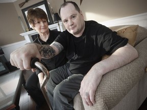 Forty-nine-year-old Allen Ogonoski spends time with his mother Sandra in her home in Lockport, just outside Winnipeg, Manitoba Saturday, December 24, 2016. Ogonoski was seriously injured when he was attacked by an inmate in a Surrey prison six years ago.