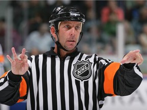 Referee Rob Shick directs traffic, establishing who’s the boss, during a 2006 National Hockey League game at GM Place in Vancouver.