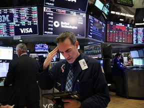 Traders work on the floor of the New York Stock Exchange on May 31, 2018 in New York City. With news of the U.S. decision to impose tariffs on steel and aluminum imports from the European Union, Canada and Mexico, the Dow Jones industrial average fell over 250 points today.