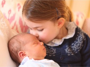 A handout picture released by Kensington Palace on May 5, 2018 shows Britain's Princess Charlotte of Cambridge and her brother Prince Louis of Cambridge posing for a photograph, taken by their mother, Britain's Catherine, Duchess of Cambridge, at Kensington Palace in central London on May 2, 2018, on Princess Charlotte's birthday.