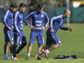 (L-R) Argentina's football players Eduardo Salvio, Manuel Lanzini, Nicolas Tagliafico and Javier Mascherano take part in a training session in Buenos Aires, on May 16, 2018 ahead of the 2018 FIFA World Cup. (Eitan Abramovich/Getty Images)