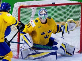 Anders Nilsson makes a save in world championship quarterfinal win over Latvia.