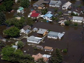 A flooded area of Grand Forks, B.C., is seen in an aerial view on Saturday May 12, 2018. Thousands of people have been evacuated from their homes in British Columbia's southern interior as officials warn of flooding due to extremely heavy snowpacks, sudden downpours and unseasonably warm temperatures.