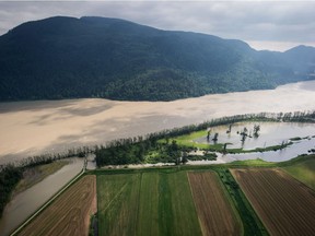Flooded farmland is seen along the Fraser River in an aerial view near Abbotsford, B.C., on Wednesday May 16, 2018.