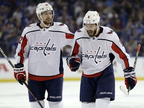 Michal Kempny, right, celebrates with Washington Capitals teammate Evgeny Kuznetsov after scoring against the Lightning during the first period of Game 1 of the Eastern Conference final on Friday night in Tampa, Fla.