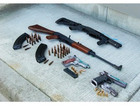 Weapons seized in the VPD's "Project Temper, a three-month operation that resulted in the dismantling of a violent and organized Vancouver-based crime group.  [PNG Merlin Archive]
