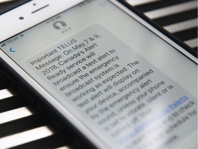 A text message from Telus is seen on a smart phone in Toronto on Friday, May 4, 2018. Mobile devices across Canada will be buzzing a little more than usual this week as emergency management officials test the new nationwide public alerting system.