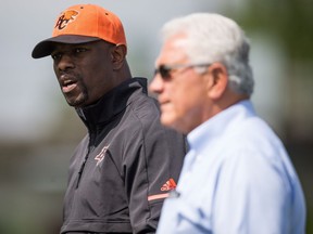 B.C. Lions' general manager Ed Hervey, back left, and head coach Wally Buono will guide the club through the 2018 season.