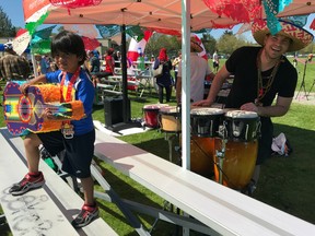 Baxter Bayer, the brains behind Saturday's inaugural La Gran Fiesta Run, plays the drums during the 10K and 5K warmups at Burnaby Lake. The run also raised funds for earthquake relief efforts in Mexico.