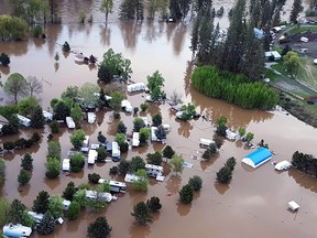 Flooding is seen along the Kettle River in Almond Gardens, B.C. in this undated handout photo. Torrential rains that pushed southern British Columbia waterways to flood stage have eased, but officials warn the new threat of unseasonable heat could rapidly melt snowpacks, adding to already swollen rivers.