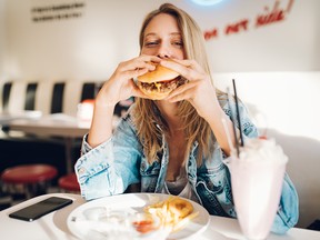 Whether you order a cheeseburger or salad, music can influence your choice, research suggests.