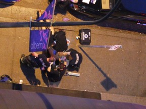 Photos from the scene of a police incident on Alberni Street on Saturday, May 5, show first responders treating the man, who was bleeding.