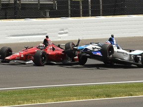 Takuma Sato, of Japan, and James Davison, of Australia, crash in the third turn during the running of the Indianapolis 500 auto race at Indianapolis Motor Speedway, in Indianapolis Sunday, May 27, 2018.