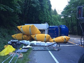 A fuel truck lies on its side with airbags deployed near Goldstream Provincial Park after a crash on the Trans-Canada Highway Thursday, May 24.