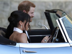 The newly married Duke and Duchess of Sussex, Meghan Markle and Prince Harry, leave Windsor Castle after their wedding on Saturday May 19, 2018, to attend an evening reception — with the bride wearing a ring that belonged to Diana, Princess of Wales.