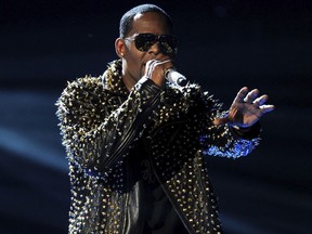 In this June 30, 2013, file photo, R. Kelly performs onstage at the BET Awards at the Nokia Theatre in Los Angeles. Streaming numbers for R. Kelly has remained intact a week after Spotify announced it had removed the R&B singer's music from its playlists, citing its new policy on hate content and hateful conduct.