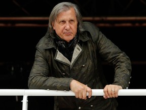 In this May 23, 2016 file picture, former Romanian tennis ace Ilie Nastase watches a match of the French Open tennis tournament at the Roland Garros stadium, in Paris, France
