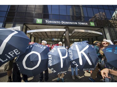 Protesters gathered outside the TD Bank tower at Georgia and Howe Streets in Vancouver to protest against TD and other banks financing the Kinder Morgan pipeline.