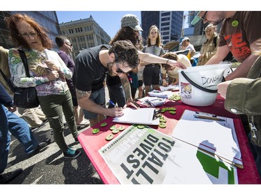 Protesters gathered outside the TD Bank tower at Georgia and Howe Streets in Vancouver to protest against TD and other banks financing the Kinder Morgan pipeline.