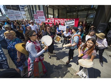 Protesters gathered outside the TD Bank tower at Georgia and Howe Streets in Vancouver to protest against TD and other banks financing the Kinder Morgan pipeline.