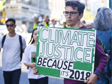 Protesters gathered outside the TD Bank tower at Georgia and Howe Streets in Vancouver to protest against TD and other banks financing the Kinder Morgan pipeline.