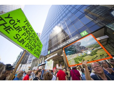 Protesters gathered outside the TD Bank tower at Georgia and Howe Streets in Vancouver to protest against TD and other banks financing the Kinder Morgan pipeline.
