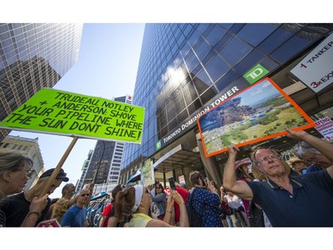 Protesters gathered outside the TD Bank tower at Georgia and Howe Streets in Vancouver to protest against TD and other banks financing the Kinder Morgan pipeline.