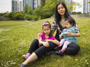 Shirley Anthony's daughters Evelene on the right and Vivien on the left. Vivien is entering Kindergarten in September. The mother of two, including 1-year-old Evelyn, is concerned about a boundary change proposed by Vancouver School Board that would impact school catchments.