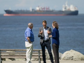 Left to right: Stuart Mackinnon, Chair, Vancouver Park Board, Vancouver mayor Gregor Robertson and Christianne Wilhelmson, Executive Director, Georgia Strait Alliance at English Bay in Vancouver, BC, May 27, 2018. Mayor Robertson provided an update on the City's efforts to recover costs from the oil spill in English Bay in April 2015.