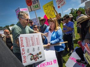 On Sunday, Attorney-Genera David Eby faced hoards of angry homeowners at a town hall, upset over the NDP's proposed school tax hike.