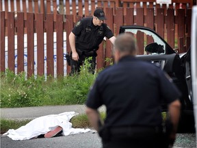 Police investigate the shooting of gang leader Randy Naicker in Port Moody on June 25, 2012.