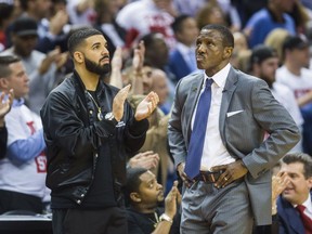 Rap music star Drake (left) and Toronto Raptors head coach Dwane Casey during the fourth quarter of Game 1 of the Raptors' NBA Eastern Conference semifinal series against the Cleveland Cavaliers at the Air Canada Centre in Toronto on May 1, 2018.