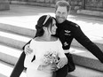 In this handout image released by the Duke and Duchess of Sussex, the Duke and Duchess are pictured together in an official wedding photograph on the East Terrace of Windsor Castle on May 19, 2018 in Windsor, England.