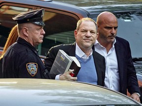 Harvey Weinstein arrives at the first precinct while turning himself to authorities following allegations of sexual misconduct, Friday, May 25, 2018, in New York.